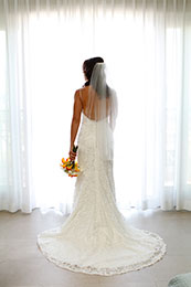 Bride stands with her back to the camera for a full dress picture in Avalon, California