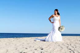 Bride stands on the New Jersey beach