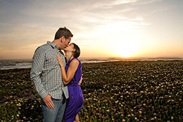 Engaged couple kisses at Piegon Point Lighthouse