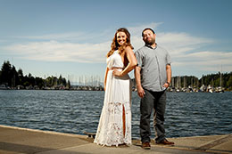 Engaged couple poses on Olympia waterfront