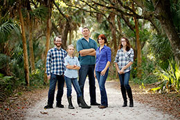 The Akeurst family stands along a road at the Koreshan State Historic Site in Estero, Florida