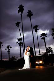 Wedding Photography Bride and Groom kiss beneath an ominous sky