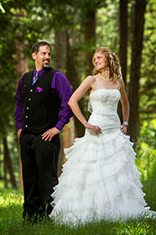 Bride and Groom pose in the forest