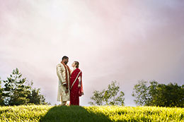 Eastern Indian wedding couple with darkening sky