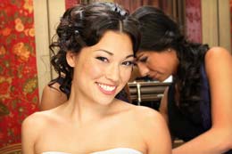 Bride poses as she gets ready
