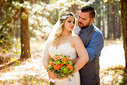 Bride and Groom lit by the sun in the forest