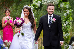 Newly married couple walks down the isle at Dragonfly Retreat