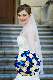 Bride smiles on the steps of the Legislative Building in Regina