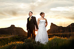 Sunset in Scotts Bluff with larger then life Bride and Groom
