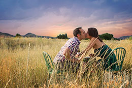 Engagement picnic kiss under fierce Kamloops sky