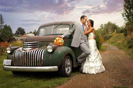 Bride and Groom beside a rustic GMC truck