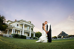 Big sky over wedding couple at Moore Mansion