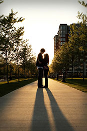 Engaged couples long shadows in Hoboken, New Jersey