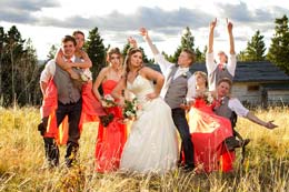 Wedding party strikes a crazy pose as the sun goes down