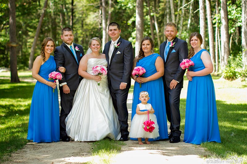 Wedding party poses along gravel driveway in Cass Lake, Minnesota