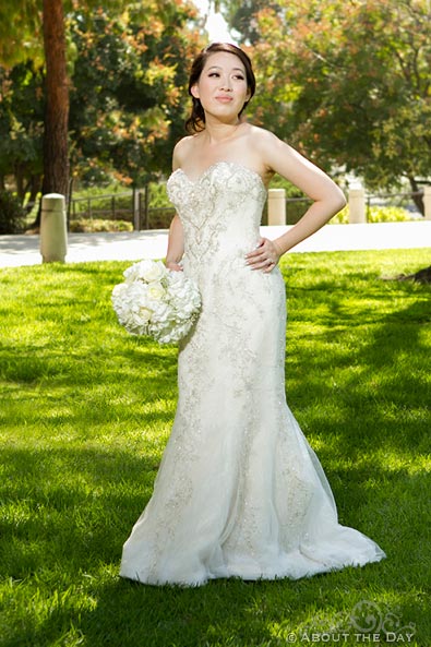 Lovely bride poses in the park
