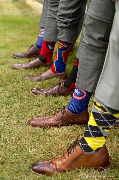 Groom and his groomsmen show their Superhero socks