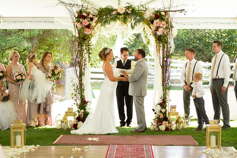 Wedding vows under a white tent