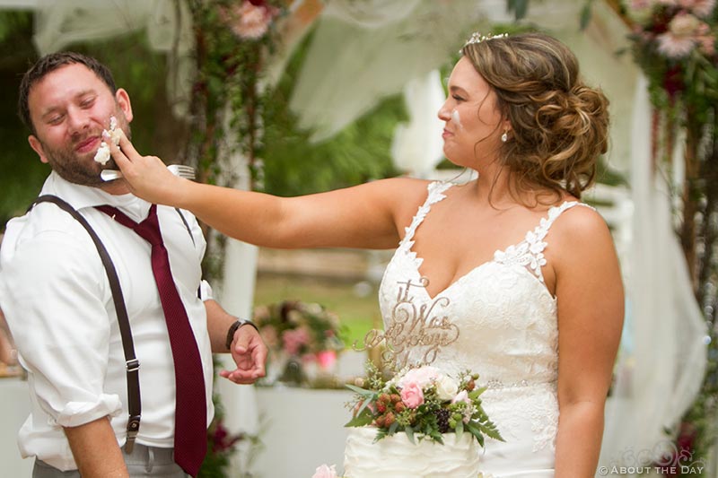 Bride gets a little cake payback on the Groom