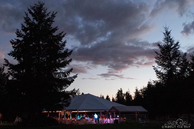 A view of the wedding tent after sunset