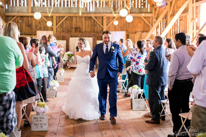 Bride and Groom exit the Youngs Dairy Farm Barn