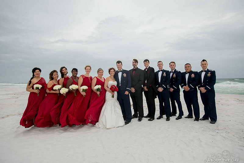 Full Wedding party during wind storm at Princess Beach in Destin, Fl