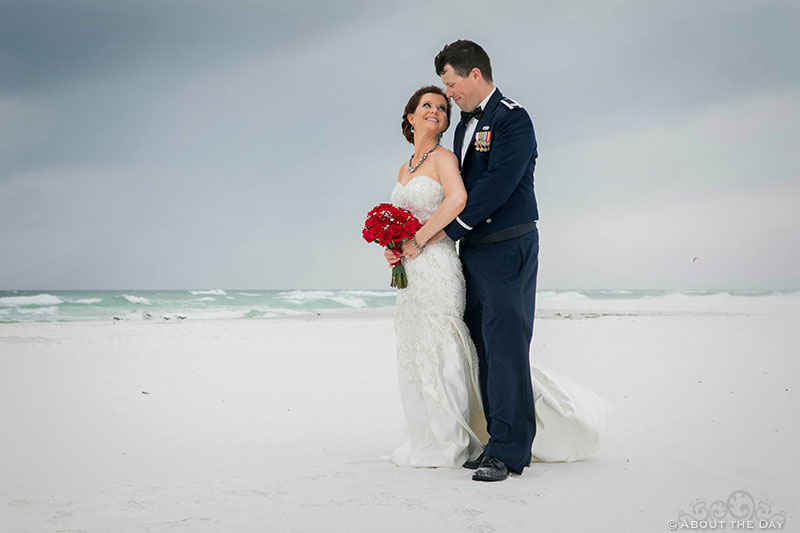 Josh and Rebecca look at each other during windstorm at Princess Beach in Destin, Fl
