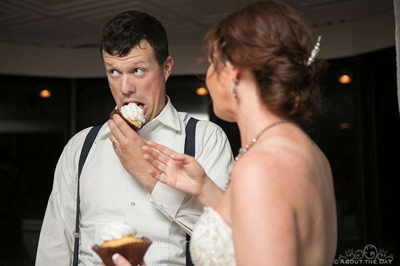 Groom tries to eat his own cake before it's pushed in his face