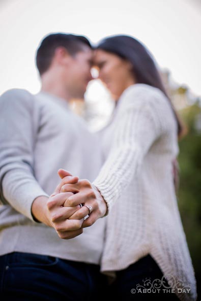 Engaged couple shows their ring up close