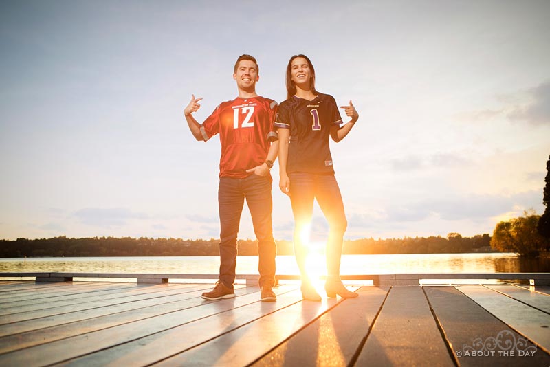 Engaged couple showing Courgars and Huskies jerseys