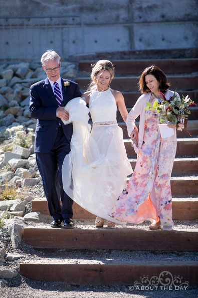 Alex and her parents walk down the isle
