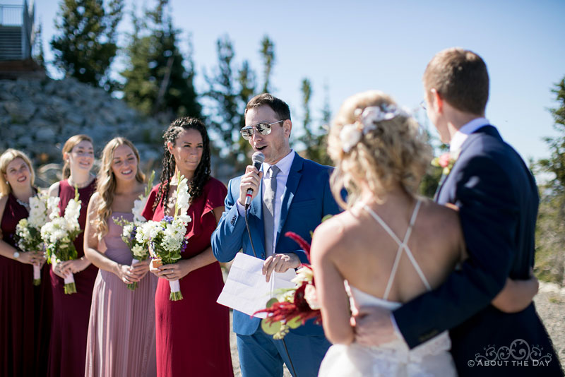 Andrew & Alex listen to a great story at their wedding