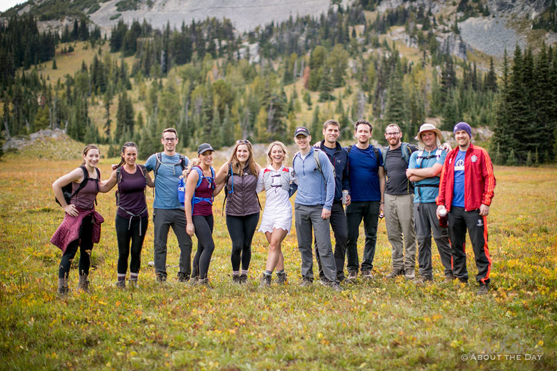 The wedding party poses in a meadow at Mt. Rainer National Park