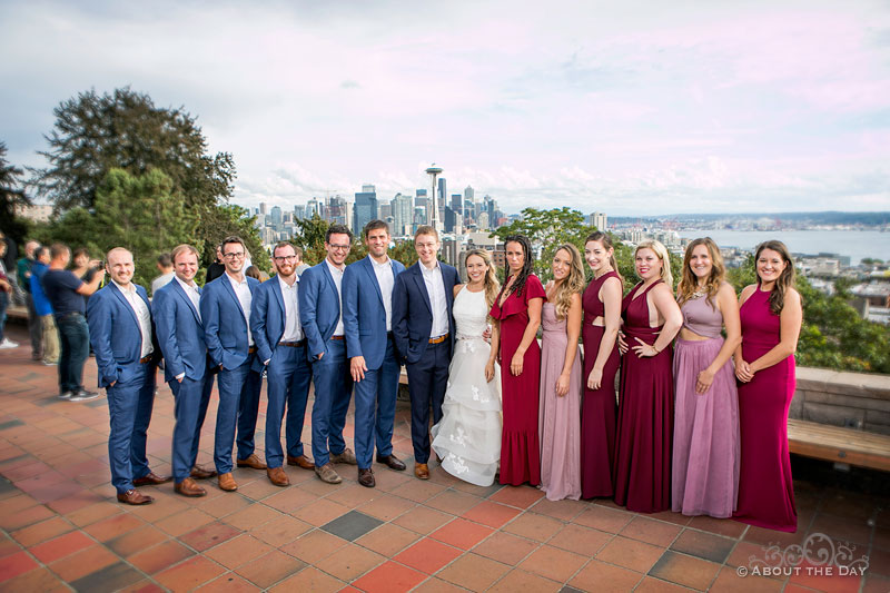 Andrew and Alex and their full wedding party at Kerry Park with Seattle in the background