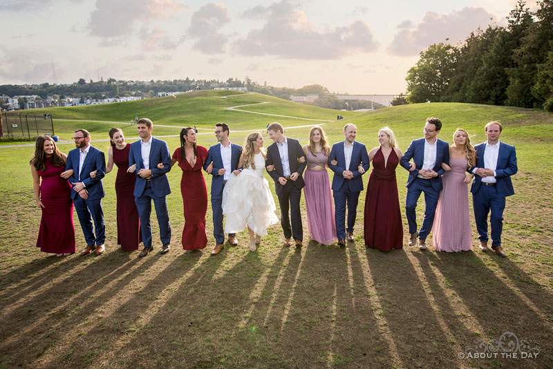 Andrew and Alex and their wedding party walk together at Gas Works Park