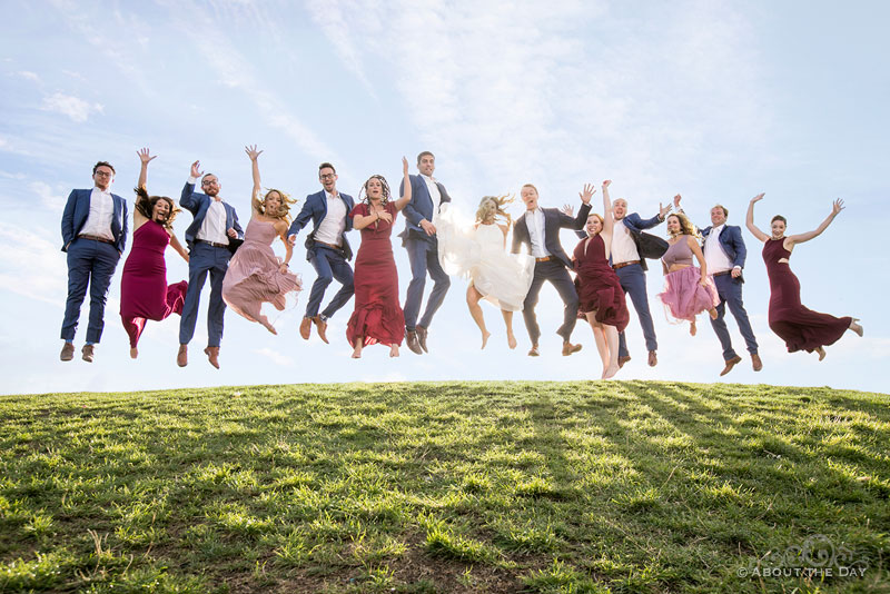 Andrew and Alex and their wedding party jump high at Gas Works Park