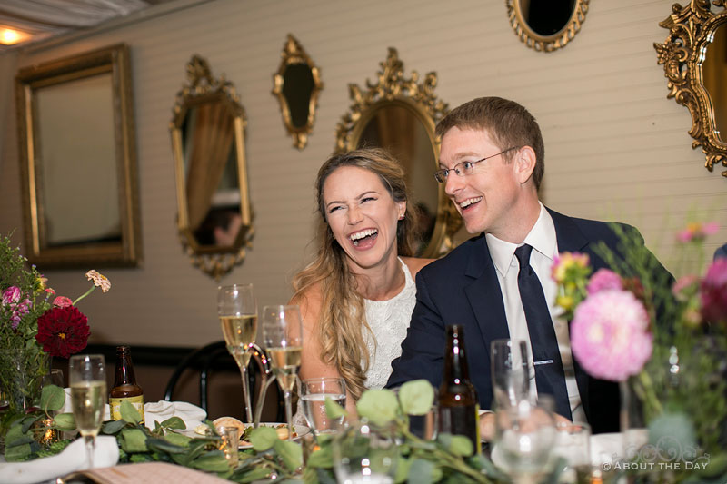 Alex and Andrew have a great laugh during the Maid of Honor's toast