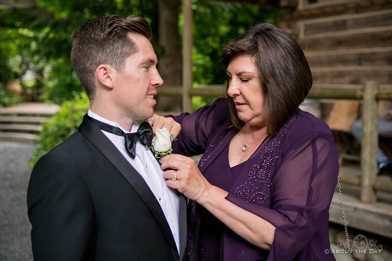 Mom helps Groom with his flower