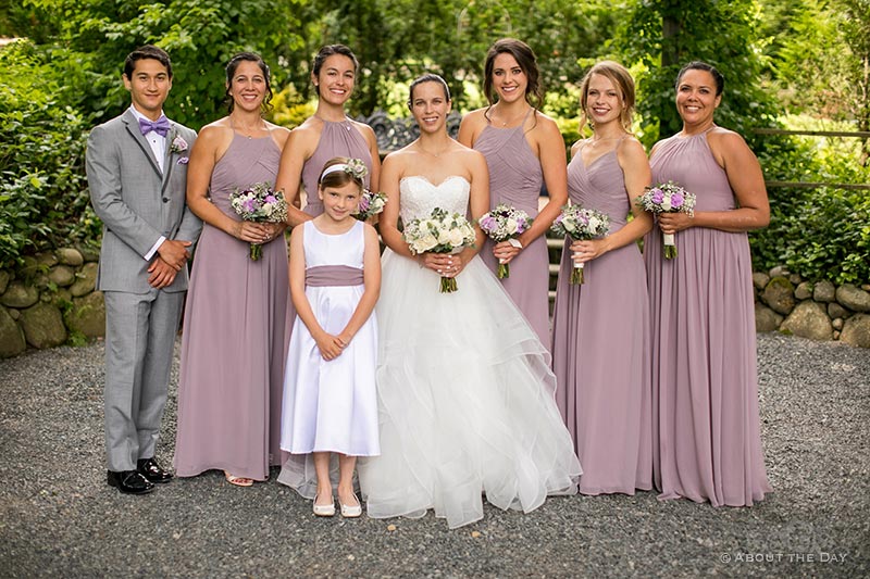 Tori and her wedding party with flower girl