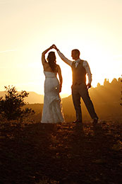 Bride and Groom twirl in the sunset