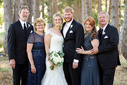 The Bride and Grooms and their parents all pose together
