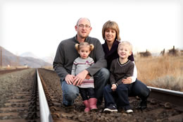 The Tuohey family risk it all for a family photo on the railroad tracks