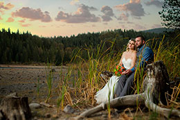 Wedding Photography Bride and Groom by the waters edge at sunset