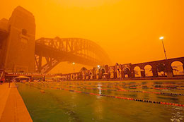 Sydney bridge fades into red sand storm of the century