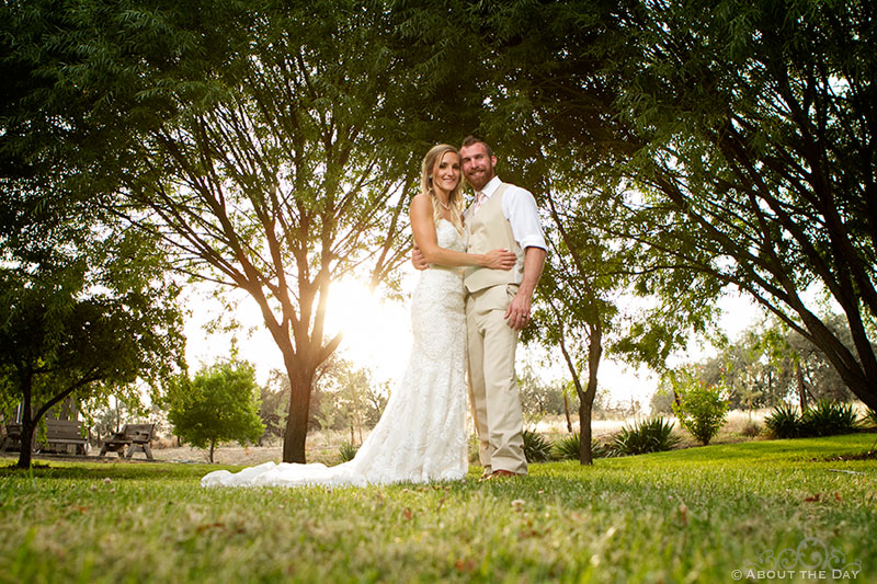Bride and Groom beneath the trees at Shadow Lake Ranch