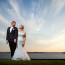 Bride and Groom pose in stunning sunset