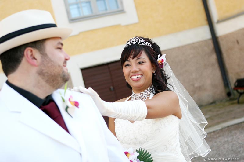 Bride touches Groom's shoulder as he turns to see her