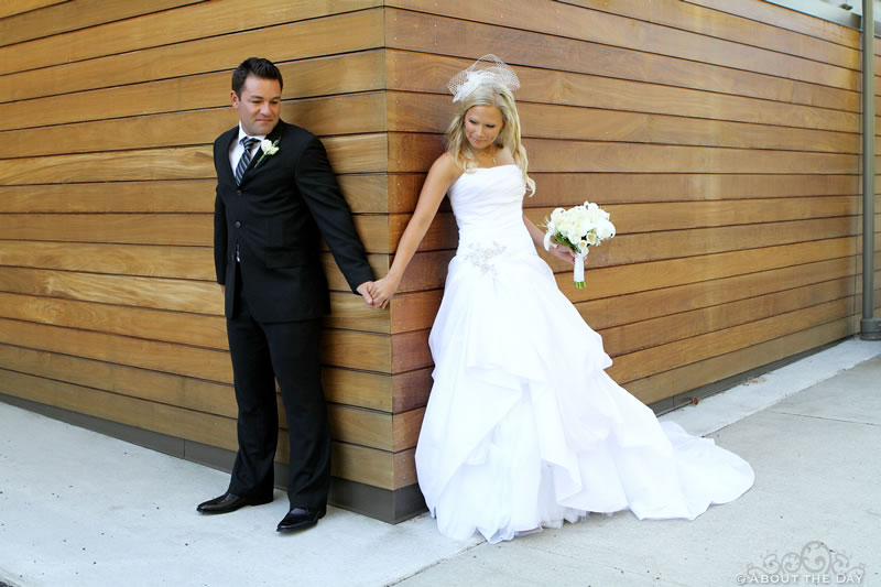 Bride and Groom touch hands but cannot see each other