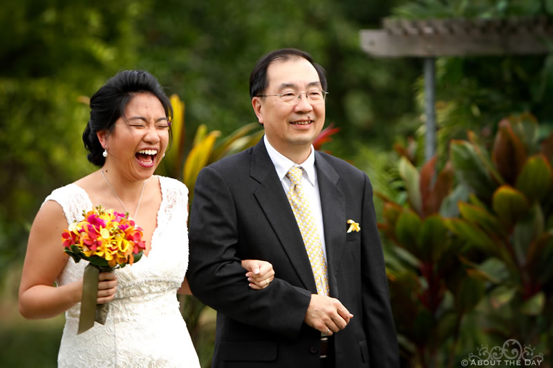 Bride laughs as she comes down the isle