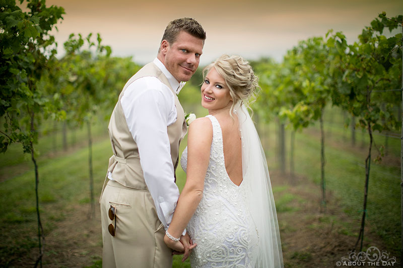 Brent and Heather look back in the rows of grapes at DC Estate Winery